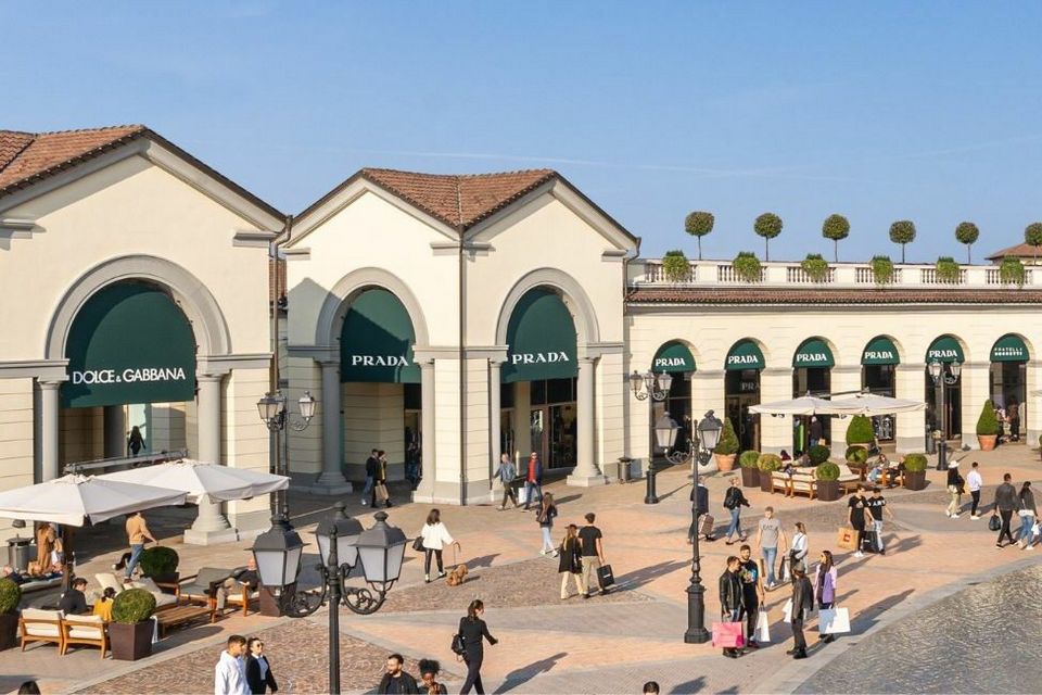 milan shopping plaza with doce and gabbana store and prada retail stores visible