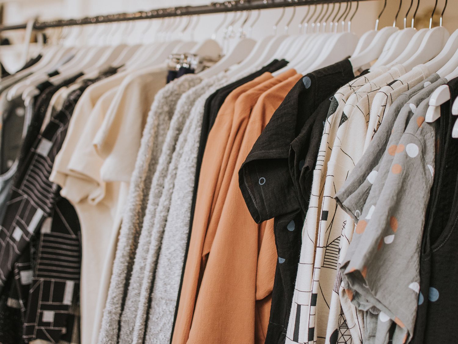 Womens' shirts hung on retail clothing rack